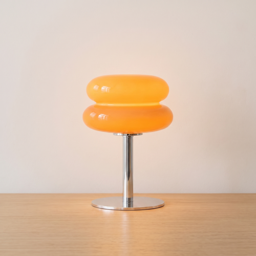 Plume table lamp lit on light oak